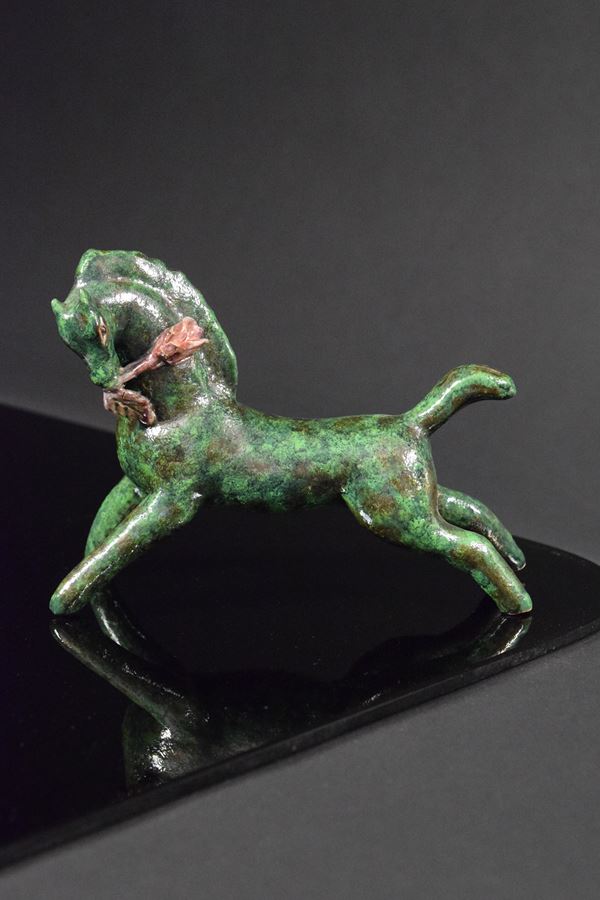 Pietro  Melandri - Cavallino verde con fiore